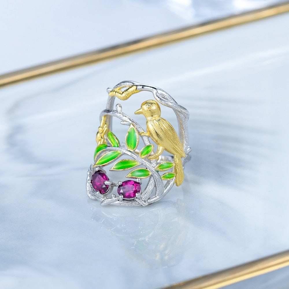 Bird Perched On A Branch Above Flowers | Sterling Silver | 18K Gold | Topaz | Amethyst | Diopside | Garnet | Ring