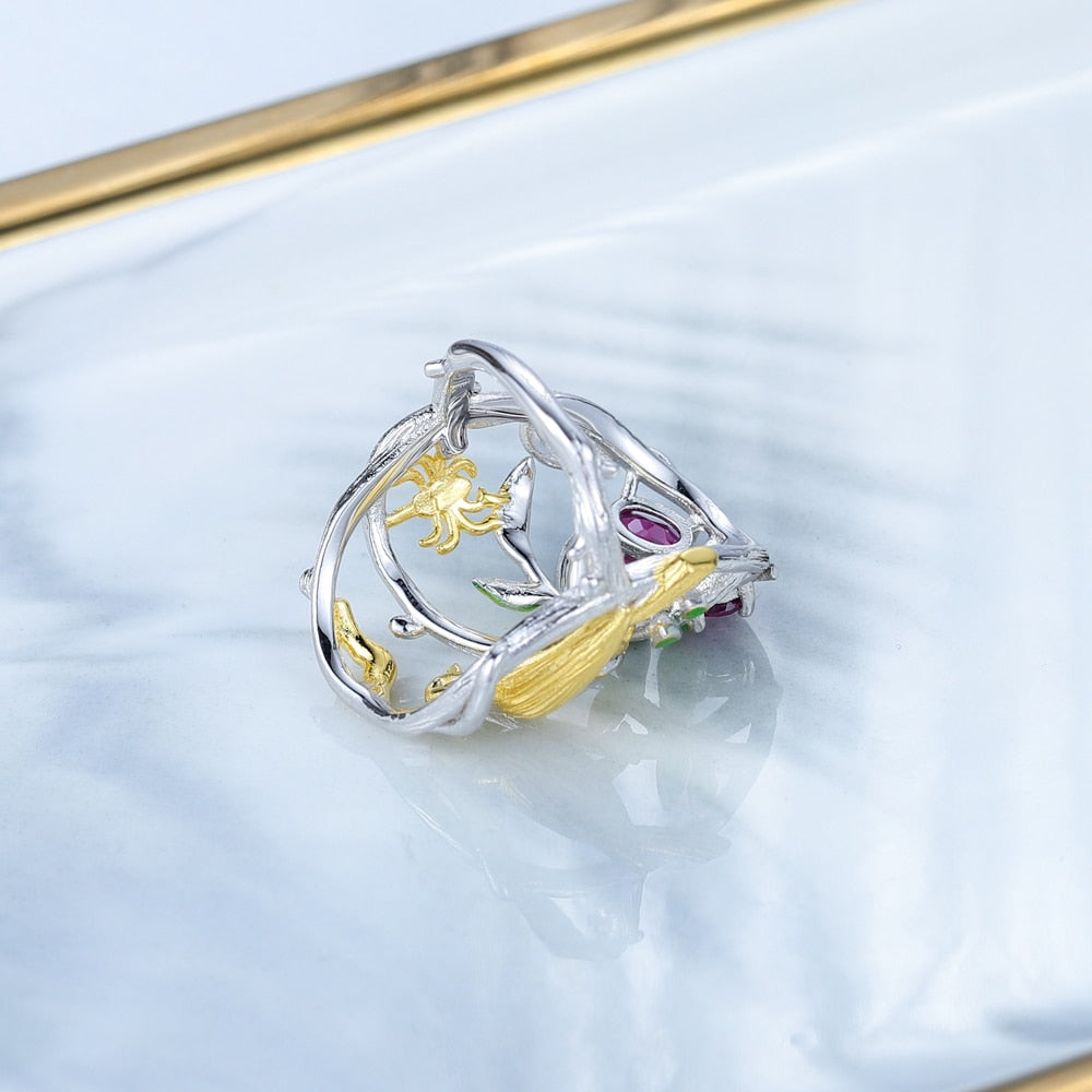 Bird Perched On A Branch Above Flowers | Sterling Silver | 18K Gold | Topaz | Amethyst | Diopside | Garnet | Ring